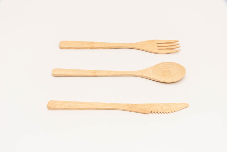 Bamboo cutlery set is a set of utensils that are made from bamboo, a sustainable and eco-friendly material. The set usually includes a fork, knife, and spoon, which can be either disposable or reusable. The bamboo cutlery set is a perfect alternative to traditional plastic cutlery, which is harmful to the environment due to its non-biodegradable nature. The bamboo cutlery set is lightweight, durable, and easy to clean. It is an ideal choice for eco-conscious consumers who want to reduce their environmental footprint while enjoying their meals.