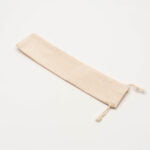 Sustainable cotton bag in natural color, featuring sturdy handles and spacious interior, perfect for eco-friendly shopping or daily use.