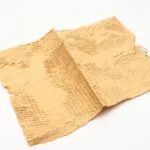 Papier alvéolé écologique utilisé pour l'emballage de la paille, offrant une protection solide tout en préservant l'environnement.