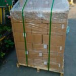 Securely packed drinking straws on a wooden pallet, prepared for efficient transportation and distribution.