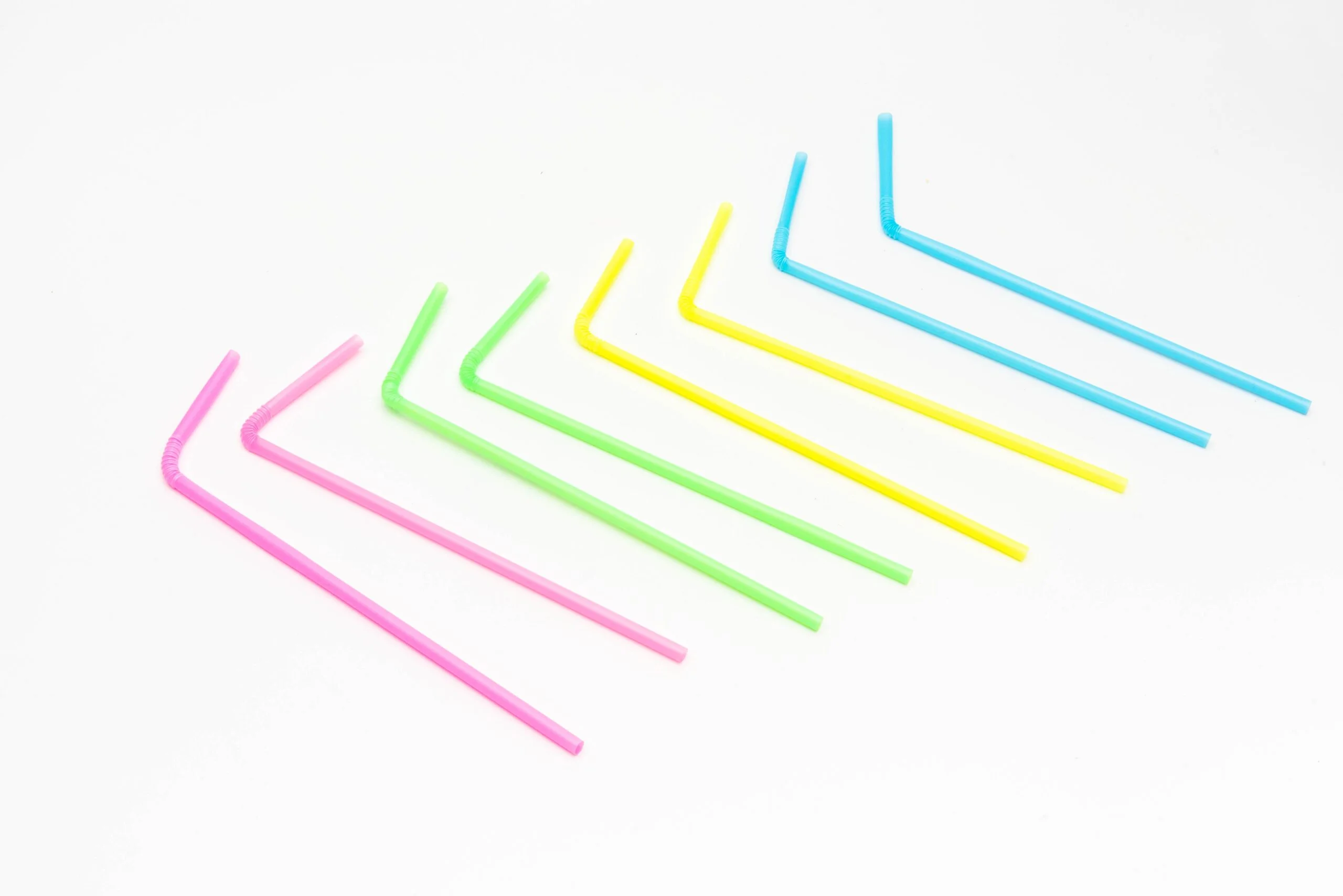 Image showing a variety of colored PLA Bendy Straws, each with a flexible section that can be bent for easier drinking.