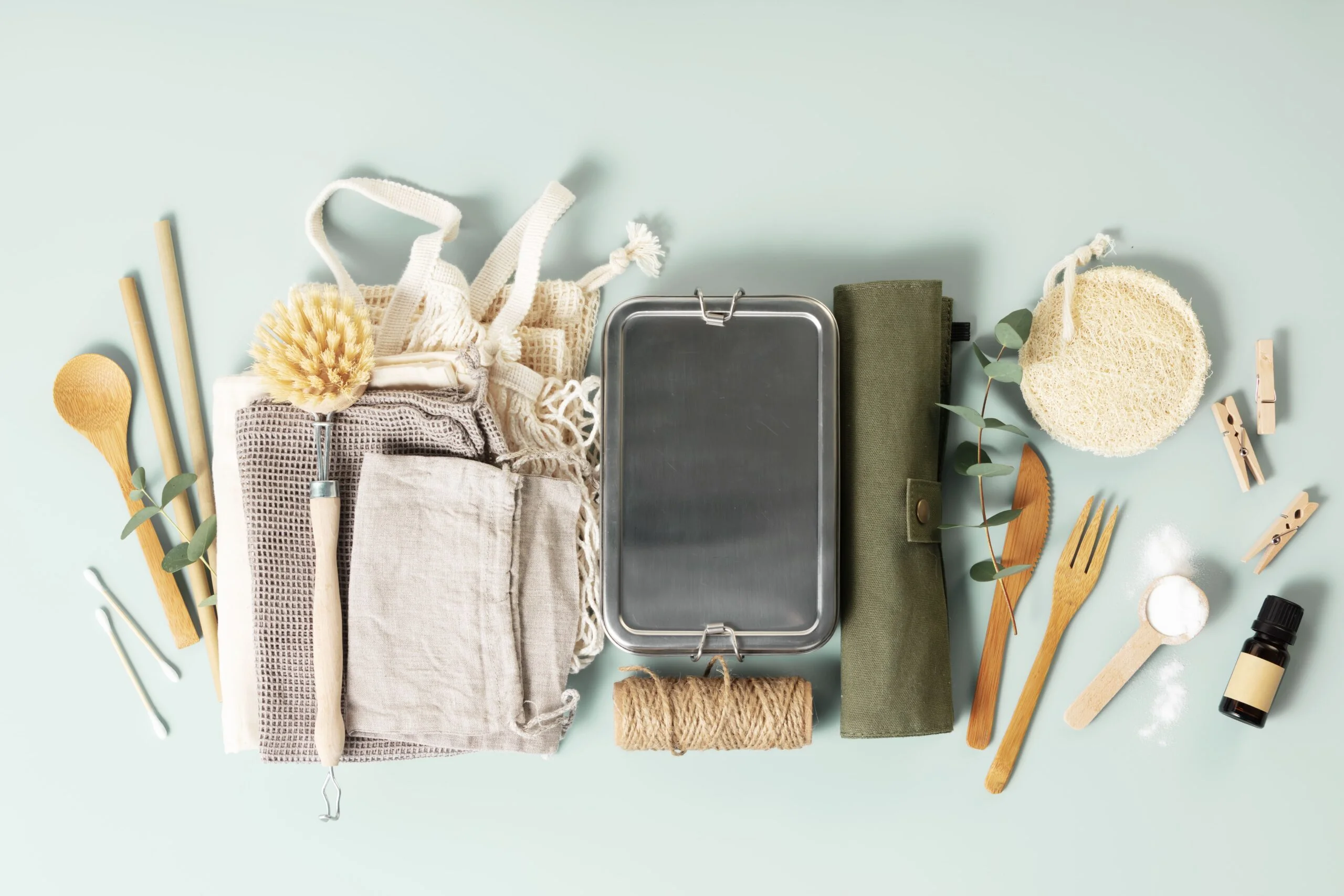 Image of Eco-Friendly Products - This picture showcases a variety of eco-friendly products offered by our company, including sustainable tableware, cleaning brushes, reusable dining utensils, and eco-conscious shopping bags.