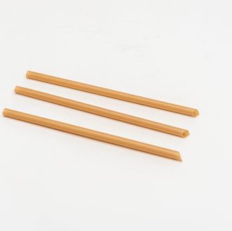 A bundle of sugarcane straws, eco-friendly alternatives to plastic straws. Made from sugarcane fiber, these biodegradable straws are sustainable and compostable.